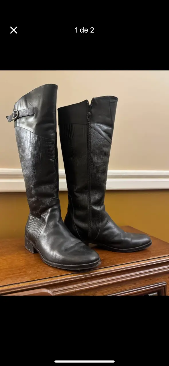 Botas de caña alta de cuero negro, ideales para el invierno. Diseño elegante y versátil, perfectas para combinar con diferentes outfits.