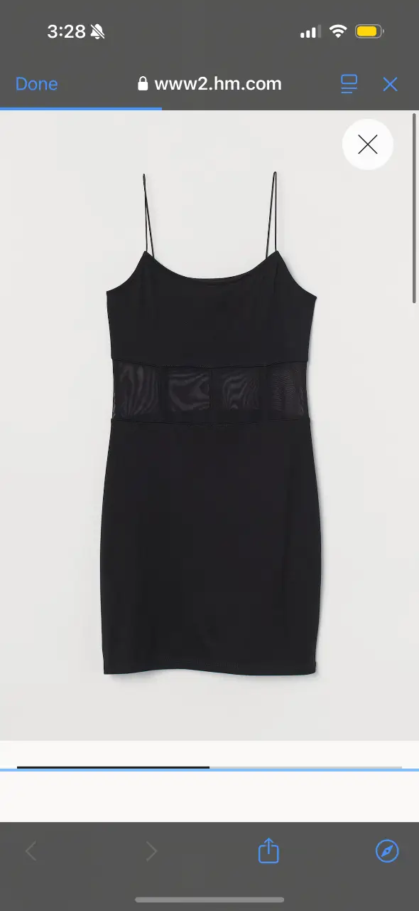 Vestido mini negro con detalles de transparencia en la cintura. Ideal para una salida o fiesta.