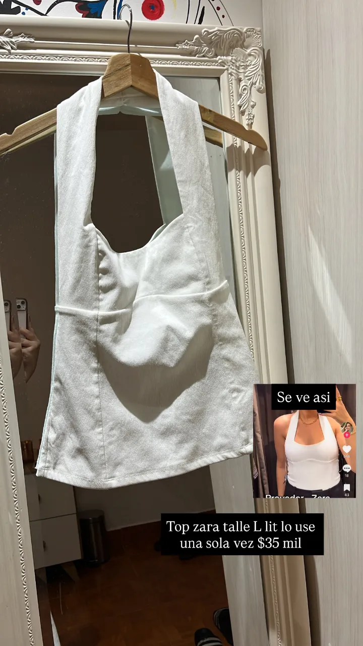 Top blanco de Zara, talle L, usado una sola vez. Ideal para un look moderno y fresco.