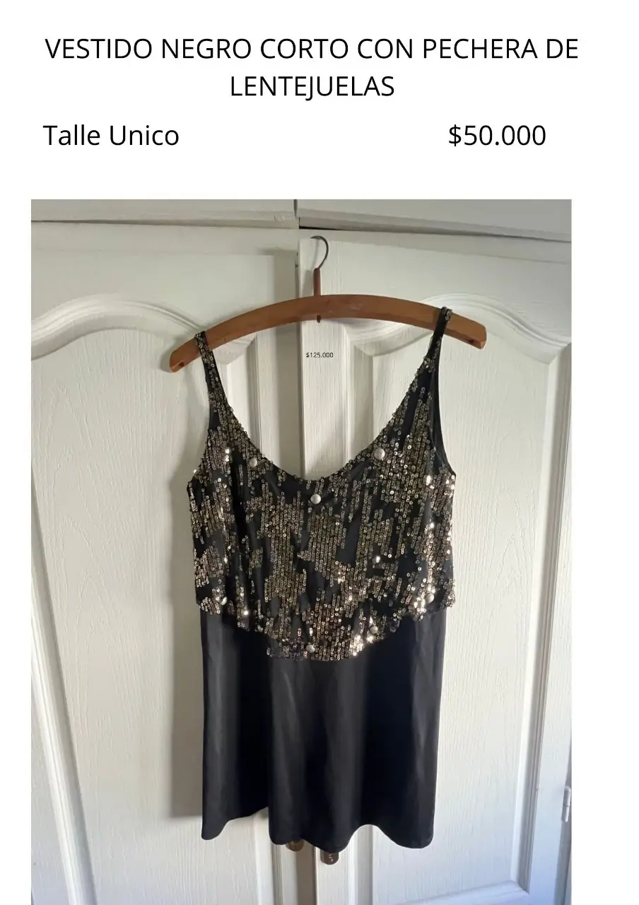 Vestido negro corto con pechera de lentejuelas. Talle único. Ideal para fiesta.