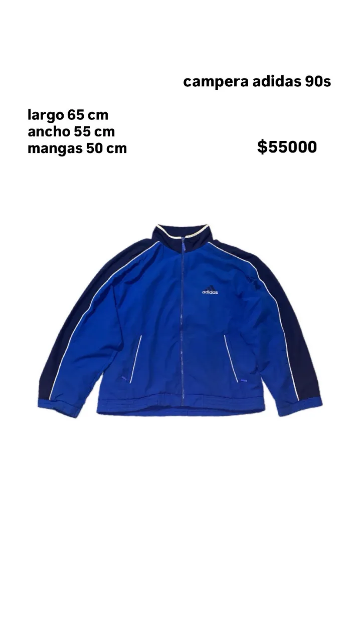 Campera Adidas 90s azul con detalles en negro. Largo 65 cm, ancho 55 cm, mangas 50 cm. Ideal para un look deportivo y vintage.