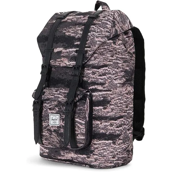 Mochila Herschel con estampa camuflada en tonos grises y rosas. Ideal para el día a día, para llevar tus esenciales con estilo. Posee múltiples compartimentos y cierres.