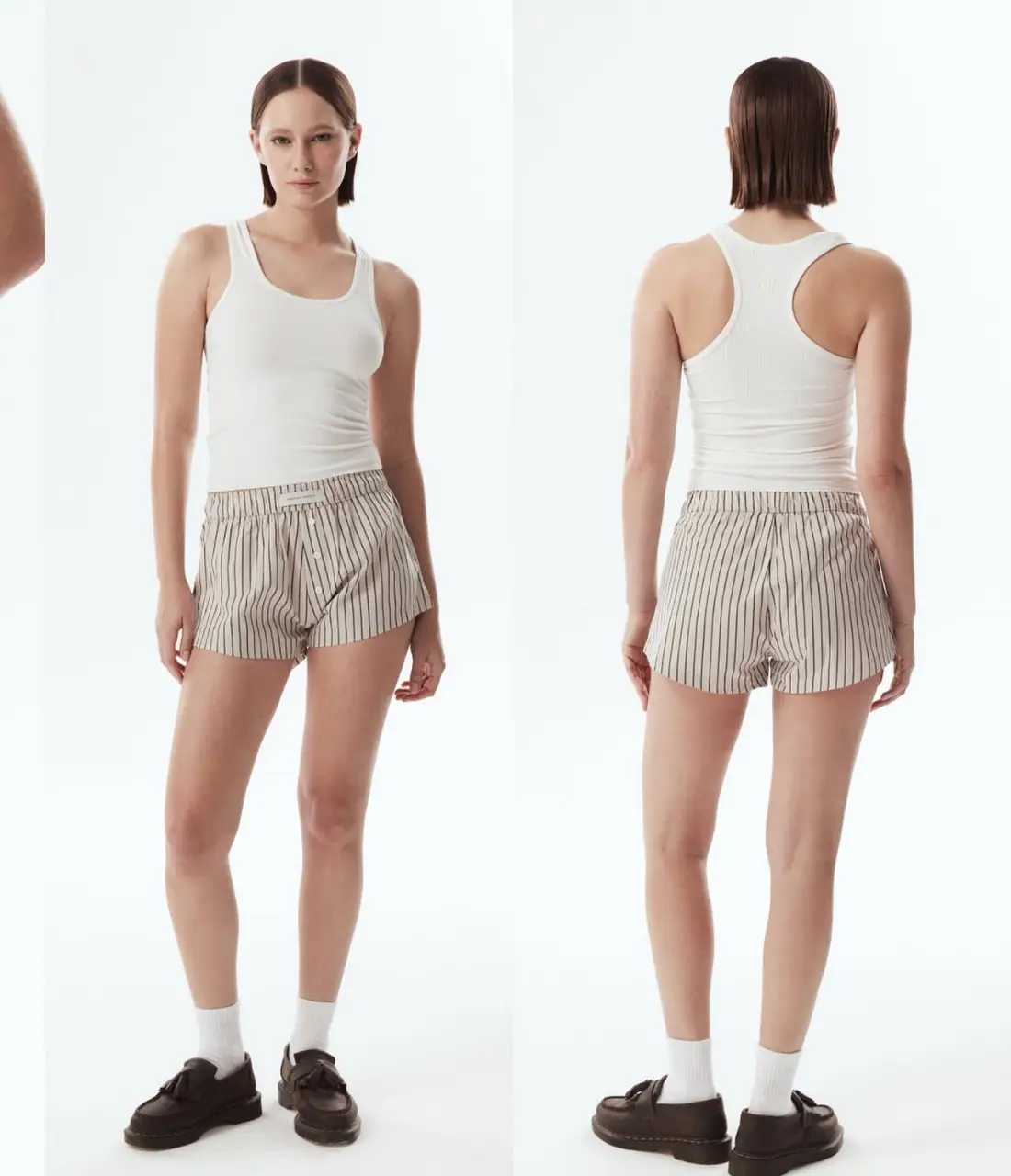 Shorts de tela a rayas en color crudo y negro, con cintura elastizada y botones. Ideal para un look casual y fresco. Temporada actual.