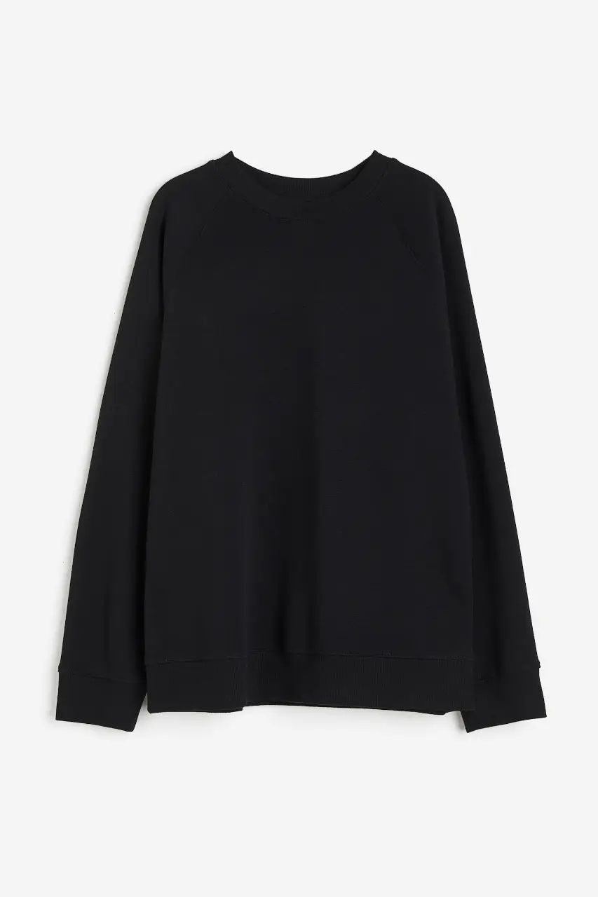 Buzo de cuello redondo negro, ideal para un look casual y cómodo. Perfecto para el día a día.