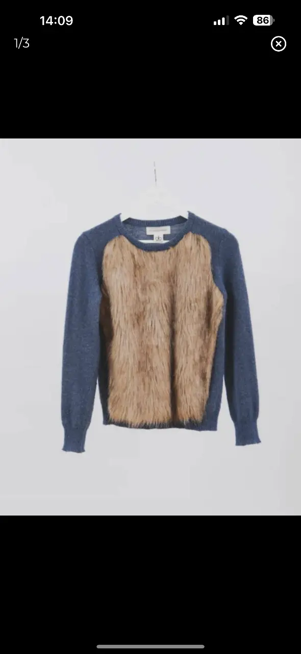 Sweater de mujer con frente de piel sintética marrón y mangas y espalda en color azul. Ideal para un look moderno y abrigado.