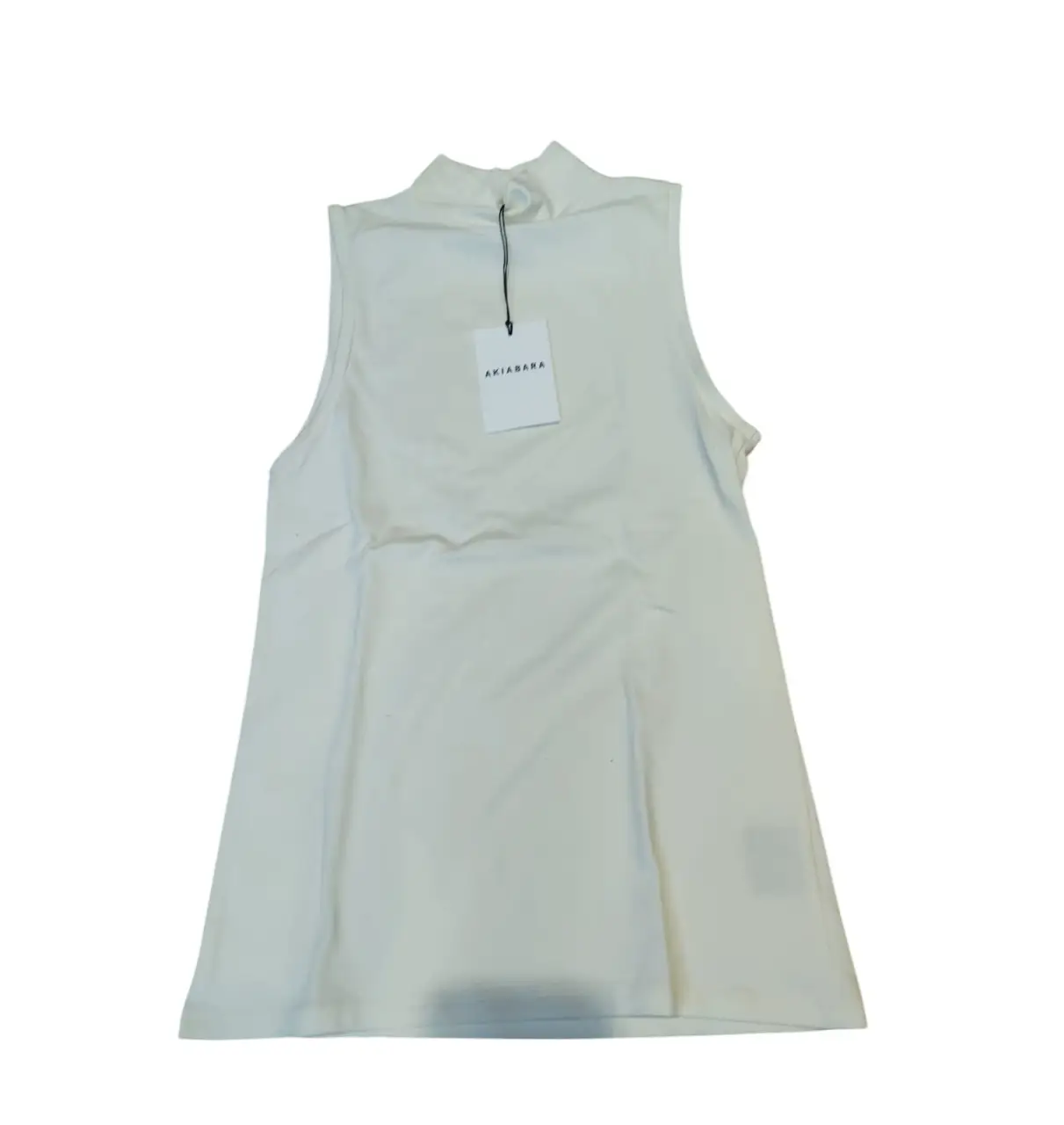 NUEVO CON ETIQUETA! Talle 1 - S. Musculosa color jazmín de cuello alto, ideal para un look casual y moderno. Perfecta para combinar con jeans o pantalones de vestir.