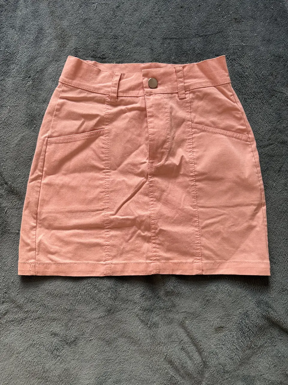 Minifalda tubo al cuerpo color coral 