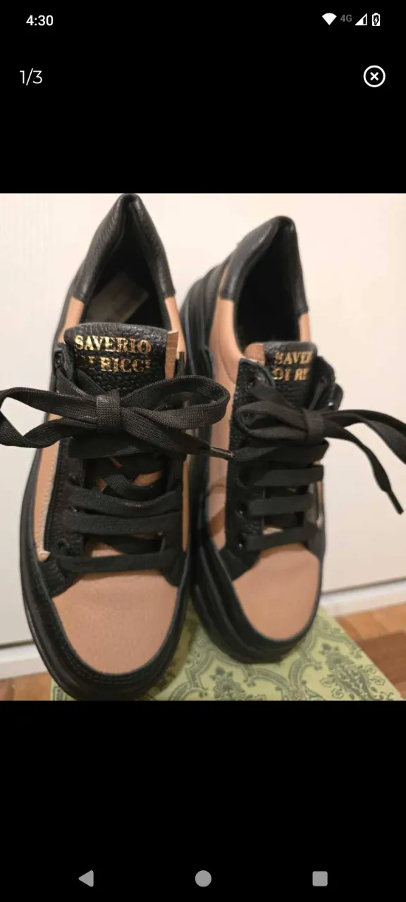 Zapatillas de cuero negras y color suela con cordones negros.se puede usar con cordones o también tiene la opción de cierre para una postura más ágil y cómoda. la plantilla mide 24,3 cm