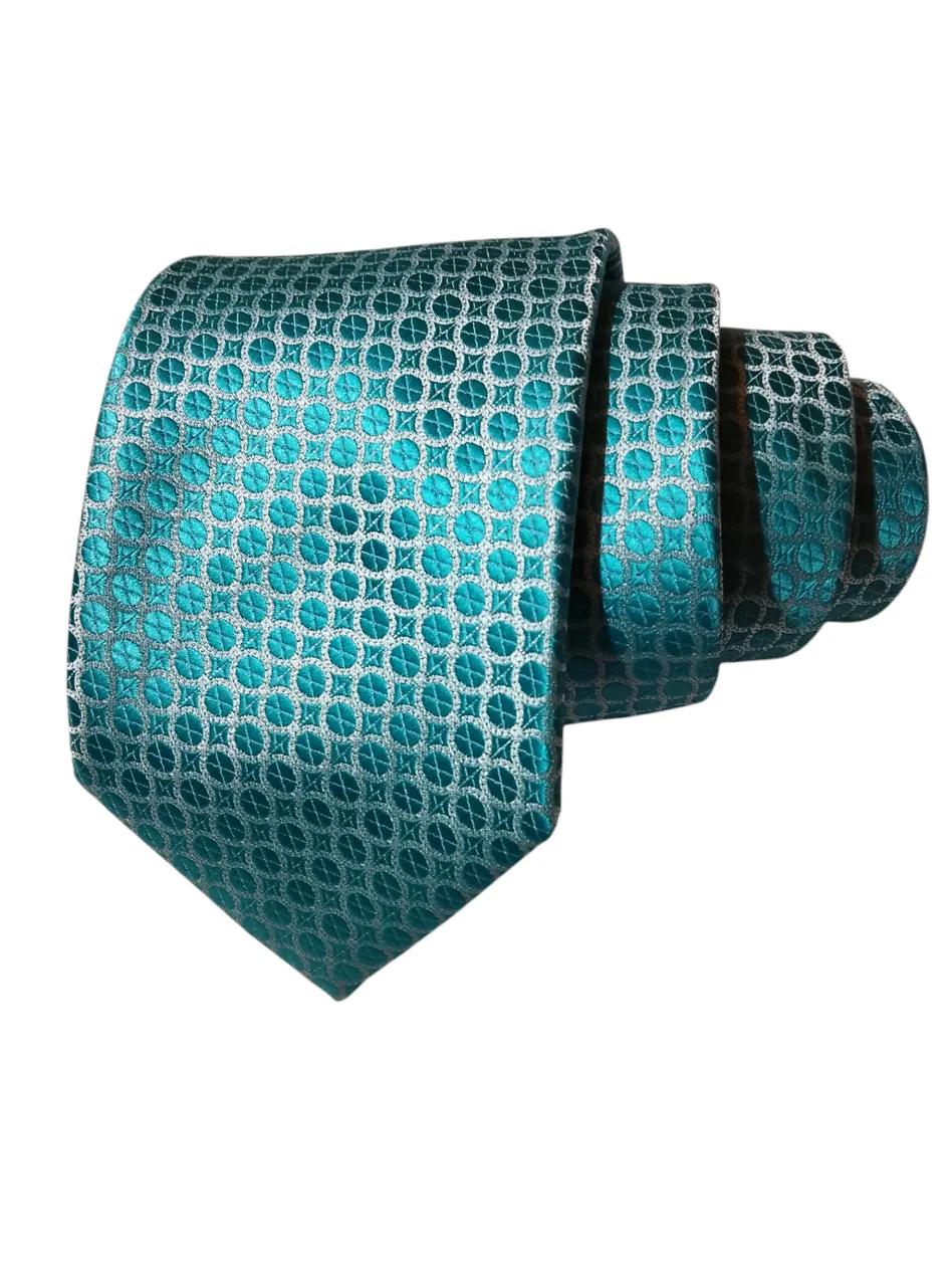 Corbata de hombre con diseño geométrico en tonos turquesa y blanco. Ideal para eventos formales o para darle un toque de elegancia a tu look de trabajo.