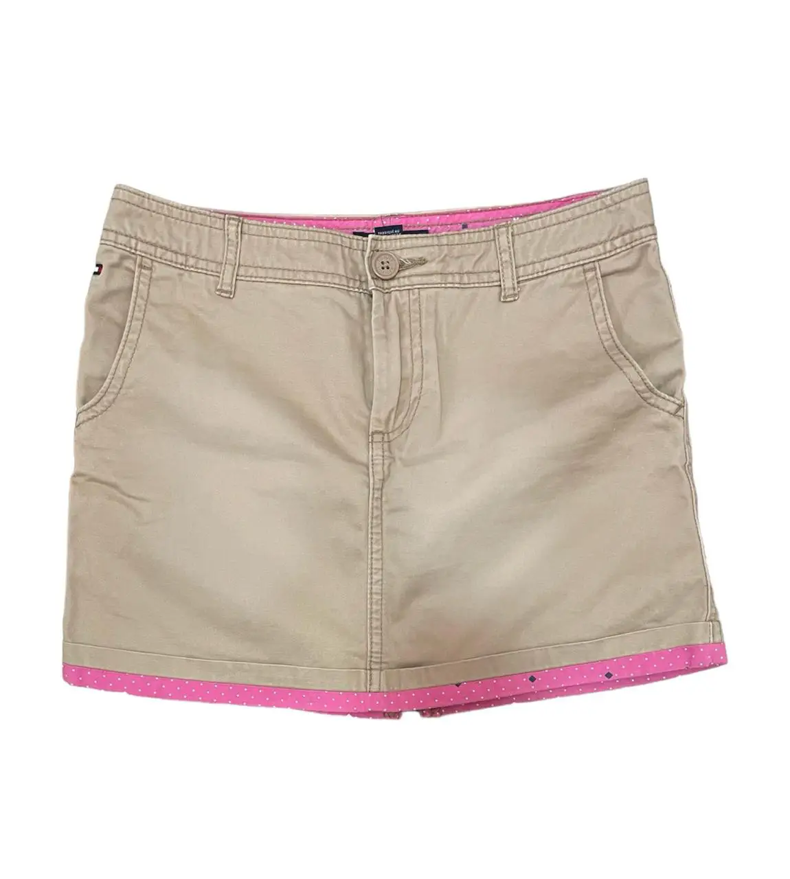 Minifalda Tommy Hilfiger color beige con forro rosa y detalles de lunares. Talle 10.
