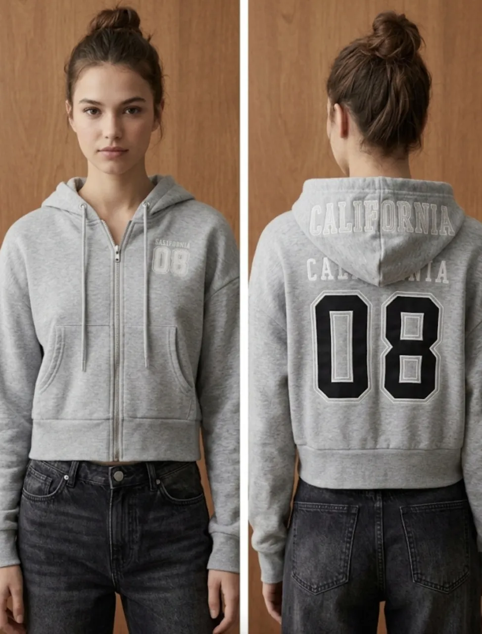 Buzo crop gris con cierre y capucha, con estampa "CALIFORNIA 08" en la espalda y en el frente. Ideal para un look casual y urbano.