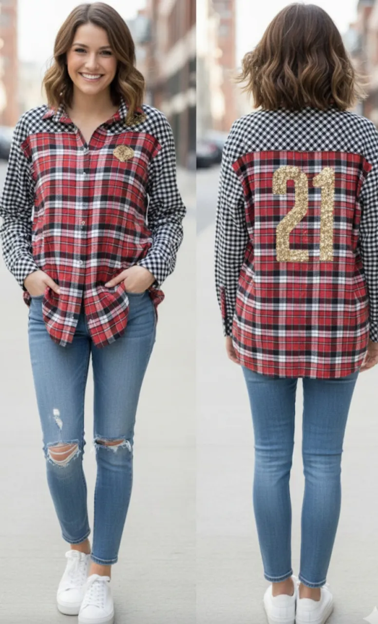 Camisa a cuadros roja y negra con mangas a cuadros vichy. Detalle de lentejuelas doradas en forma de número "21" en la espalda. Ideal para un look casual y canchero.