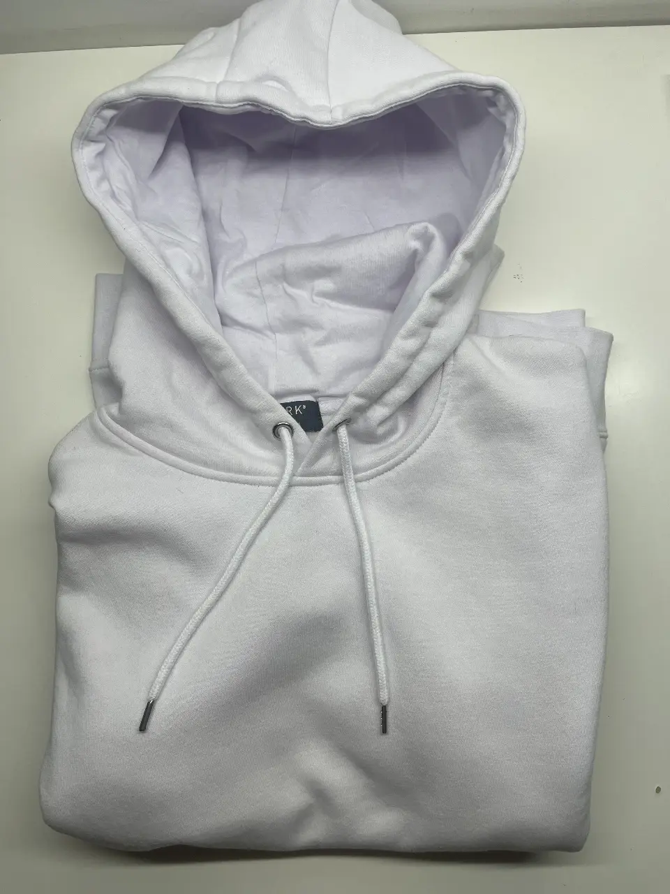 Buzo canguro blanco de la marca Primark, talle Large. Ideal para un look casual y cómodo.
