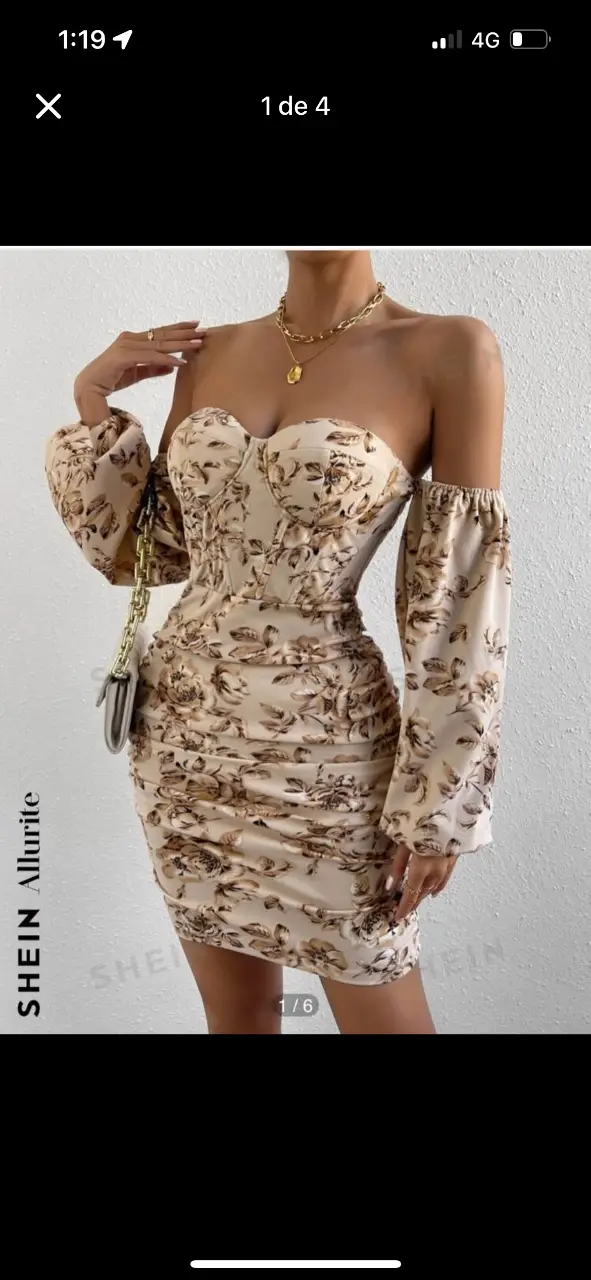 Vestido mini strapless con estampado floral en tonos beige y marrón. Diseño ajustado con frunces y mangas largas abullonadas. Ideal para fiestas y eventos.
