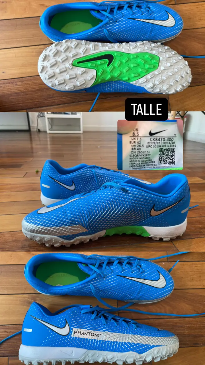 Zapatillas de fútbol Nike Phantom, talle 8.5 US, con tapones para césped sintético. Color azul con detalles en blanco y plateado. Ideales para jugar al fútbol con estilo y rendimiento.