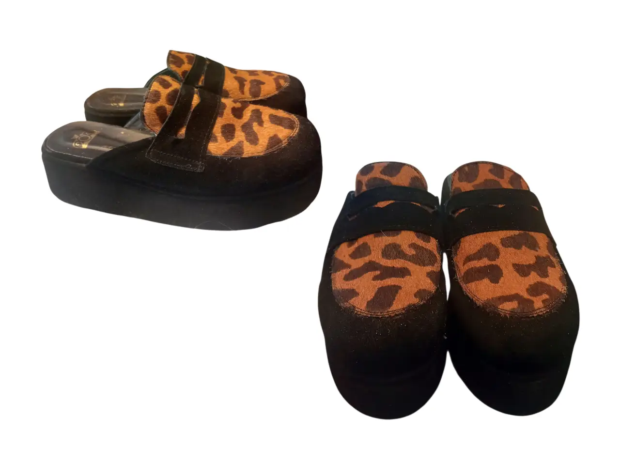 Zuecos con plataforma y estampado de leopardo. Diseño moderno y audaz, ideales para un look urbano y con estilo.