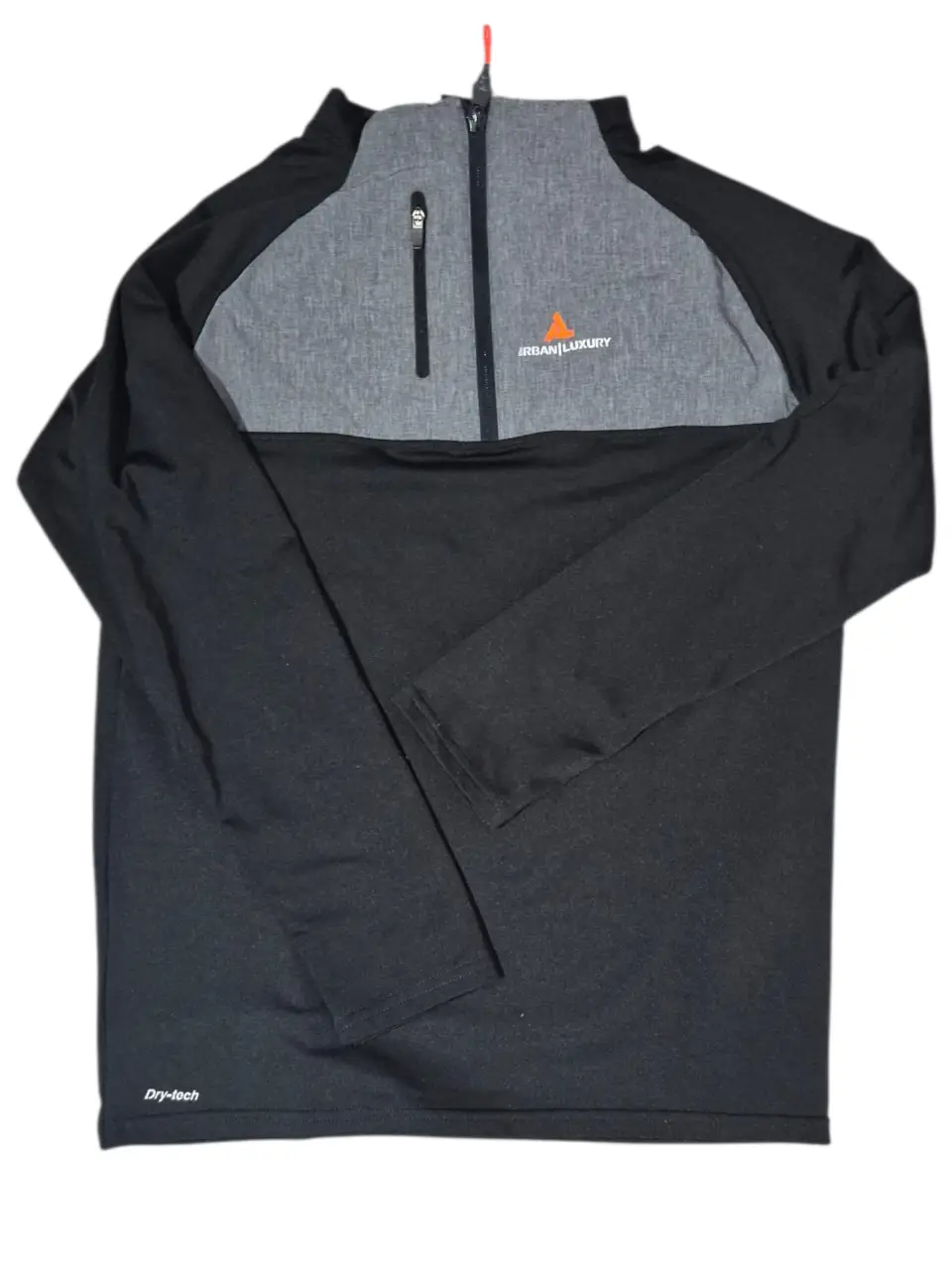 Buzo deportivo con cierre y detalles en gris. Ideal para actividades al aire libre o uso casual. Confeccionado con tejido Dry-tech.