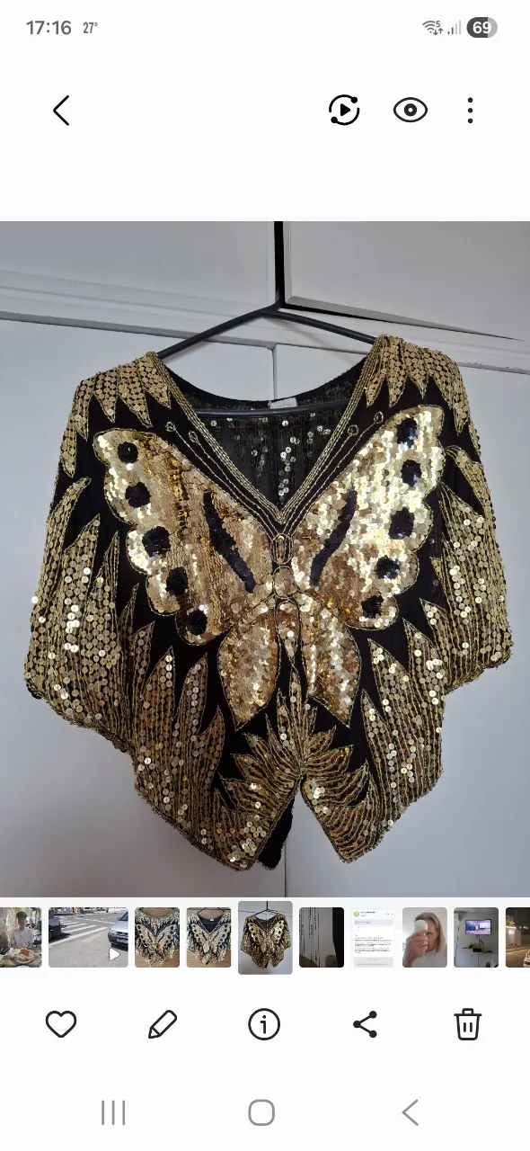 Top negro con mariposa bordada en lentejuelas doradas y plateadas. Posee detalles de bordado en todo el contorno.