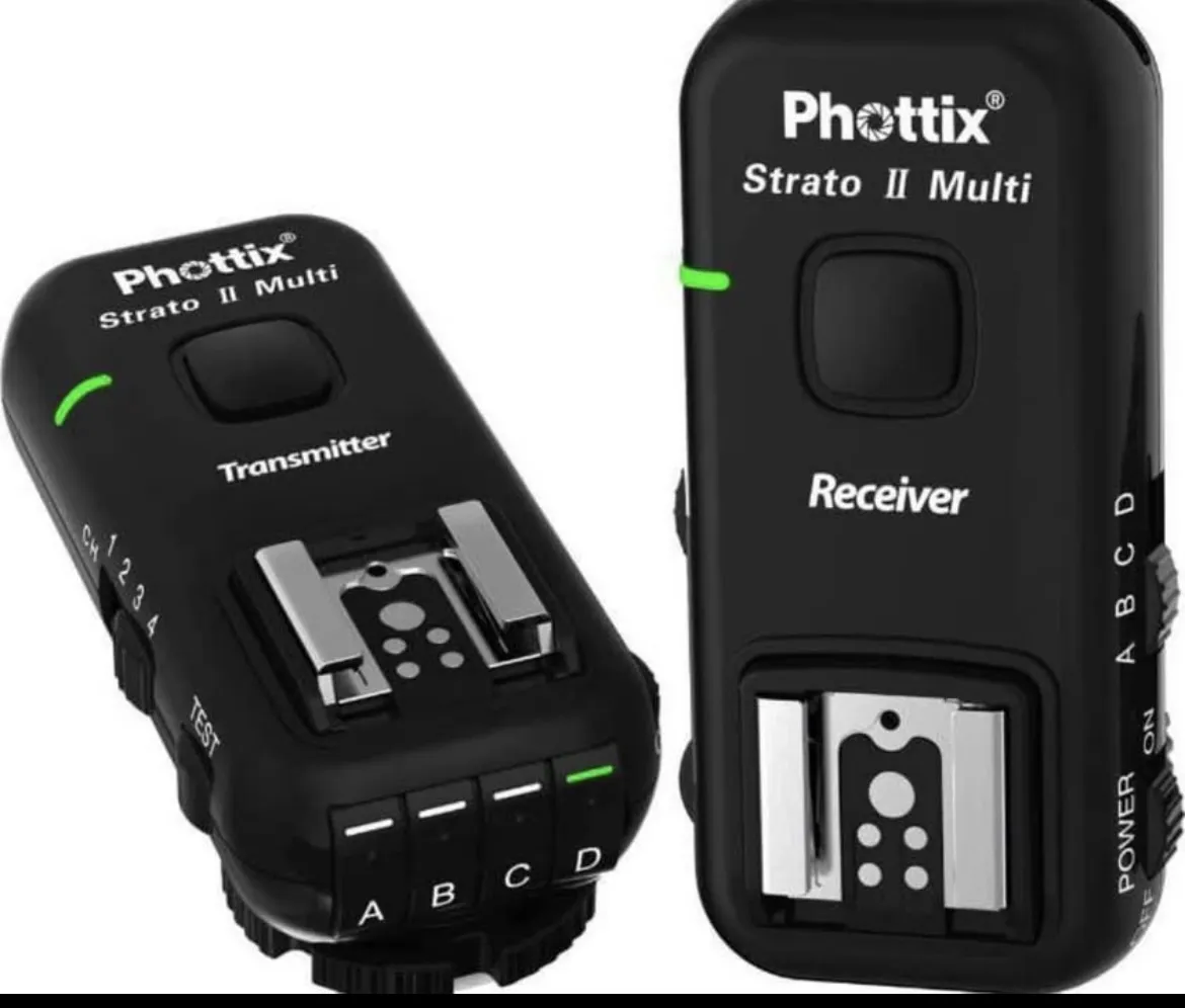 Kit de disparador y receptor Phottix Strato II Multi 2.4GHz Wireless para flashes y strobes. Incluye 4 grupos y 4 canales, compatible con TTL y disparador manual remoto. Ideal para fotógrafos que buscan versatilidad y control en sus sesiones.