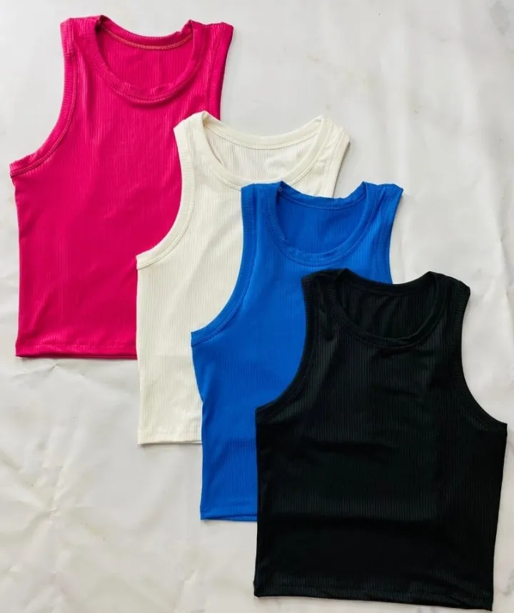 Pack de 4 tops musculosa de mujer, de tela rib, disponibles en rosa, blanco, azul y negro. Ideales para combinar con cualquier outfit casual.