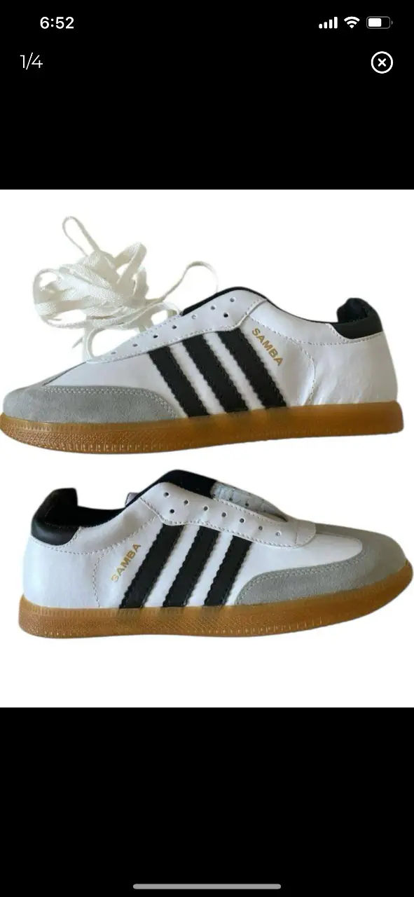 Zapatillas Adidas Samba (no OG) blancas con detalles en negro y suela de goma. Un clásico del calzado deportivo, ideales para un look casual y cómodo.  27cm plantilla