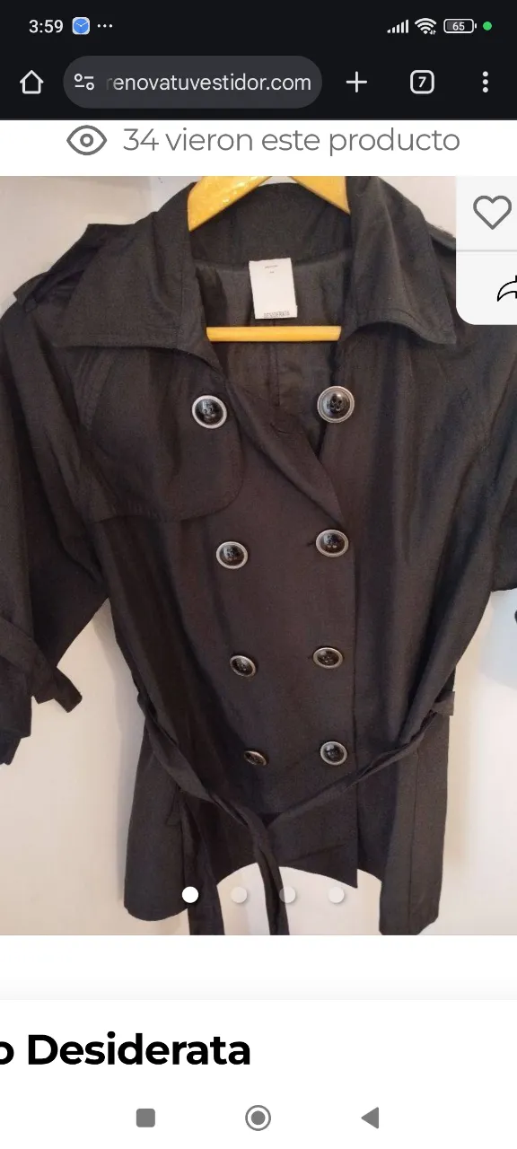 Trench negro con botones y cinturón. Ideal para un look elegante y sofisticado. Perfecto para usar en otoño e invierno.